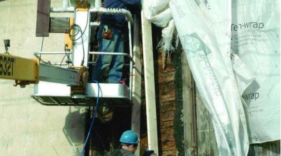 Volunteers help fix wall at Conover